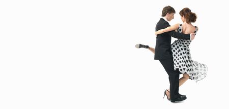 young couple dancing argentinian tango, on white backgroundの写真素材