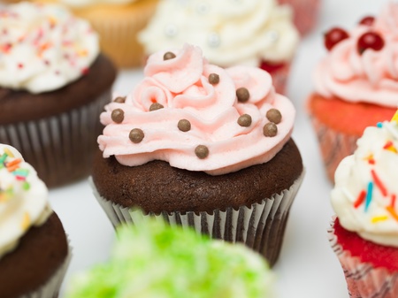 group of multicolored ornate details muffins white backgroundの写真素材