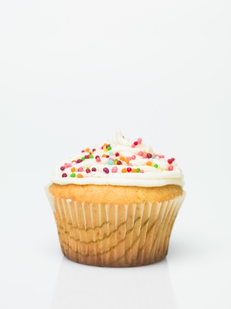 detail muffin with candy ornaments on white backgroundの写真素材