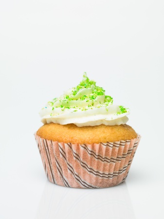 detail muffin with candy ornaments on white backgroundの写真素材