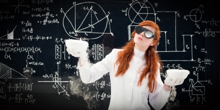 Young female scientist comparing two pots in front of a blackboard filled with chemical formulas in...