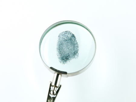 top view of a fingerprint viewed through a magnifying glass, against a white backgroundの写真素材