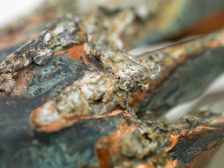 macro of a metal object covered with rustの写真素材