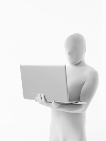 faceless man dressed white sitting with a laptop in armの写真素材