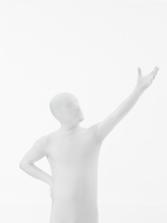 faceless man dressed in white with hand raised upの写真素材