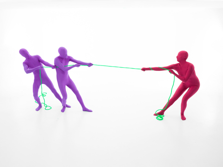 faceless strangers pull a green rope on whiteの写真素材