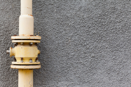 gray wall gas pipe rust pointsの写真素材