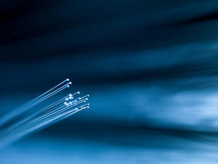 macro of bright blue fiber optics on defocused backgroundの写真素材