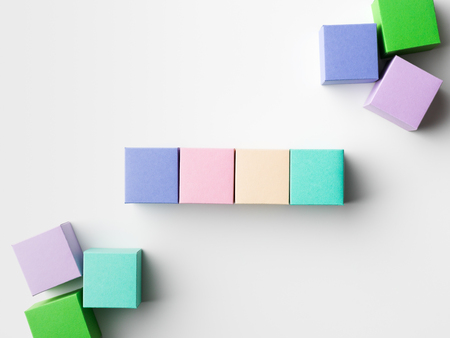 close-up of empty colorful paper cubes on white background. copy space available