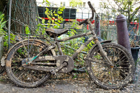bicycle abandoned on the streets of Amsterdam rustyの写真素材