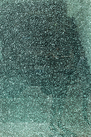background texture of a tempered safety glass broken into many pieces