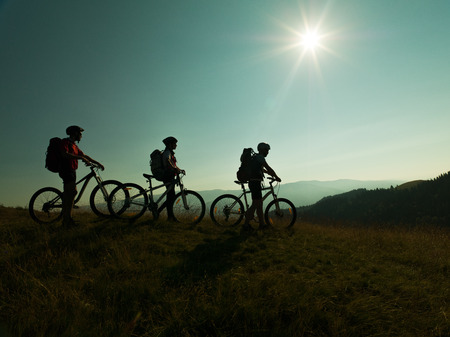 mountain bikers ready for an adventure on the mountainの写真素材