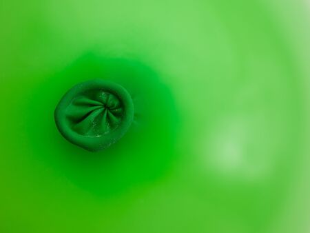 detail of a green balloon ring holeの写真素材