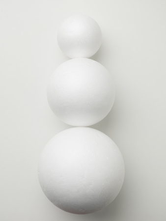 abstract snowman made from spheres on a white backgroundの写真素材