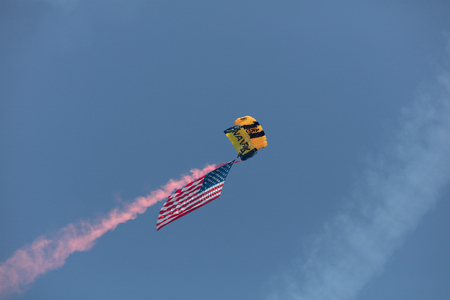 USA, Chicago - August 19: Sky diver perform at Chicago Air and Water shows presenting the American flag on August 19, 2017のeditorial素材