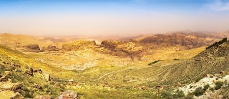 Travel to Middle East country Kingdom of Jordan - blue sky over mountain around Wadi Araba (Arabah, Arava, Aravah) area near Petra town in sunny spring day.のeditorial素材