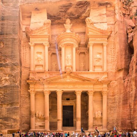 PETRA, JORDAN - APRIL 25, 2016: People near al-Khazneh temple (The Treasury) in ancient Petra. Rock-cut town Petra was established about 312 BC as the capital city of the Arab Nabataeanのeditorial素材