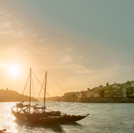 Porto, Portugal old town cityscape on the Douro River with traditional Rabelo boatsの写真素材