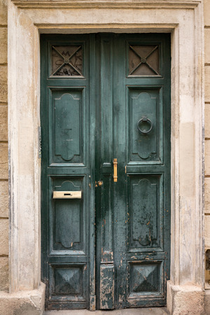 green  door with bronze detailsの写真素材