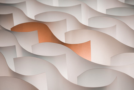 Close up textured abstracted beauty ocean-liked why orange sheet made from paper.の写真素材