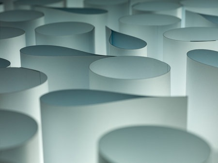 Elliptical rolls of white paper macro background detail.の写真素材