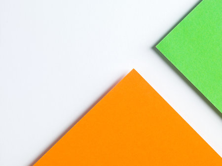 colored paper red an orange on white backgroundの写真素材