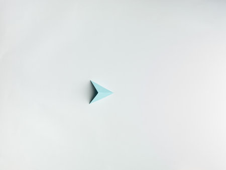 blue paper pyramid , on white background copy space available.