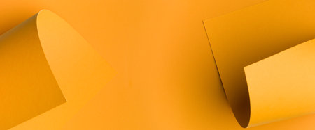 orange banner abstract color paper for background, monochrome curled corner, page curl. Abstract creative background, modern mock up. Design element for advertising and promotional message.の写真素材
