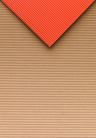 Recycled cardboard paper abstract envelope. Red on brown.の写真素材