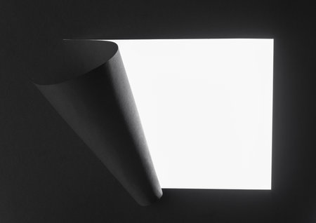 Breakthrough paper hole on isolated white background.の写真素材