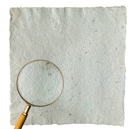 Recycled grey vintage note paper texture with  vintage magnifier on top.の写真素材