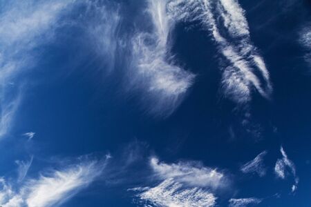 white clouds in sunny blue skyの写真素材