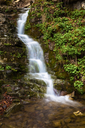 spring fresh waterfall in italian mountainの写真素材