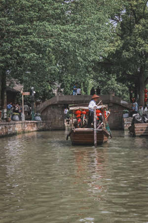 Cruise ship and boatman in the ancient town Â· Photographed from Zhujiajiao Ancient Town, Qingpu,...