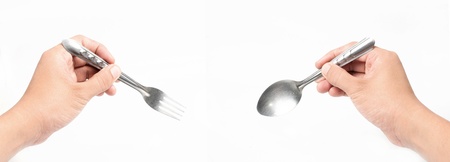 Holding a forkの写真素材