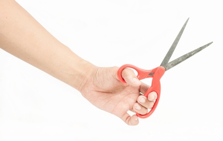 Sewing scissors in hand isolated on whiteの写真素材
