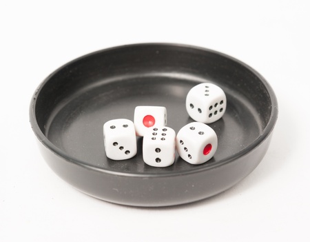 Thrown dice isolated on white backgroundの写真素材