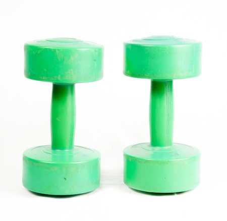 green dumbbell isolated on a white backgroundの写真素材