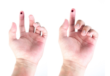 finger with blood isolatedの写真素材