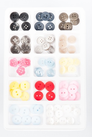 buttons of different size, shape and color isolated on whiteの写真素材
