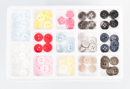 buttons of different size, shape and color isolated on whiteの写真素材
