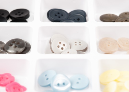 buttons of different size, shape and color isolated on whiteの写真素材