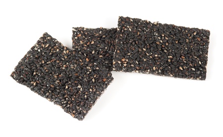 Honey bars with black sesame seeds isolated on white background
