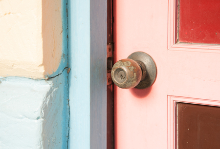 Door knob and keyhole made of brassの写真素材