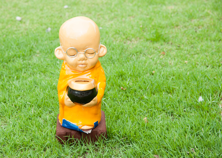 Statue of serenity novice on green grassの写真素材