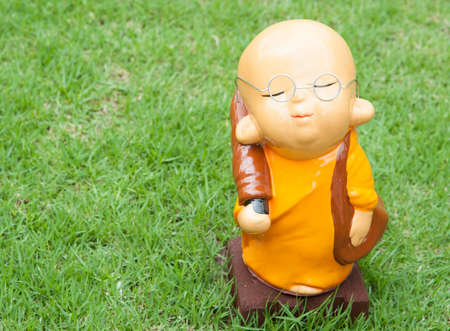 Statue of serenity novice on green grassの写真素材
