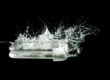 light bulb drops into waterの写真素材