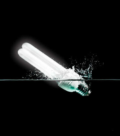 light bulb drops into waterの写真素材