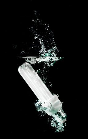 light bulb drops into waterの写真素材