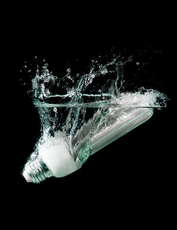 light bulb drops into waterの写真素材